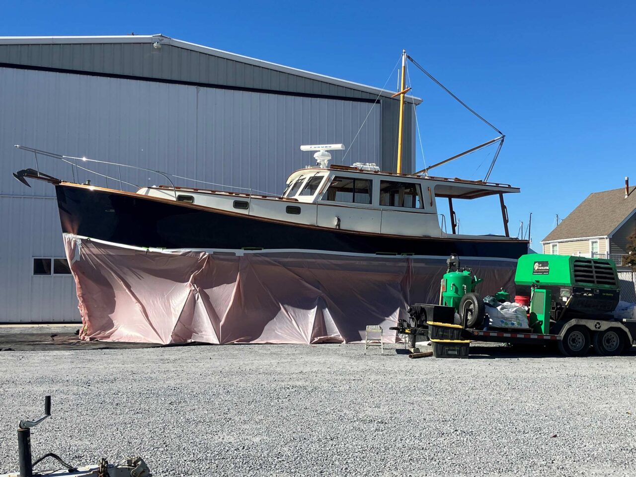 Shearwater boat being soda blasted